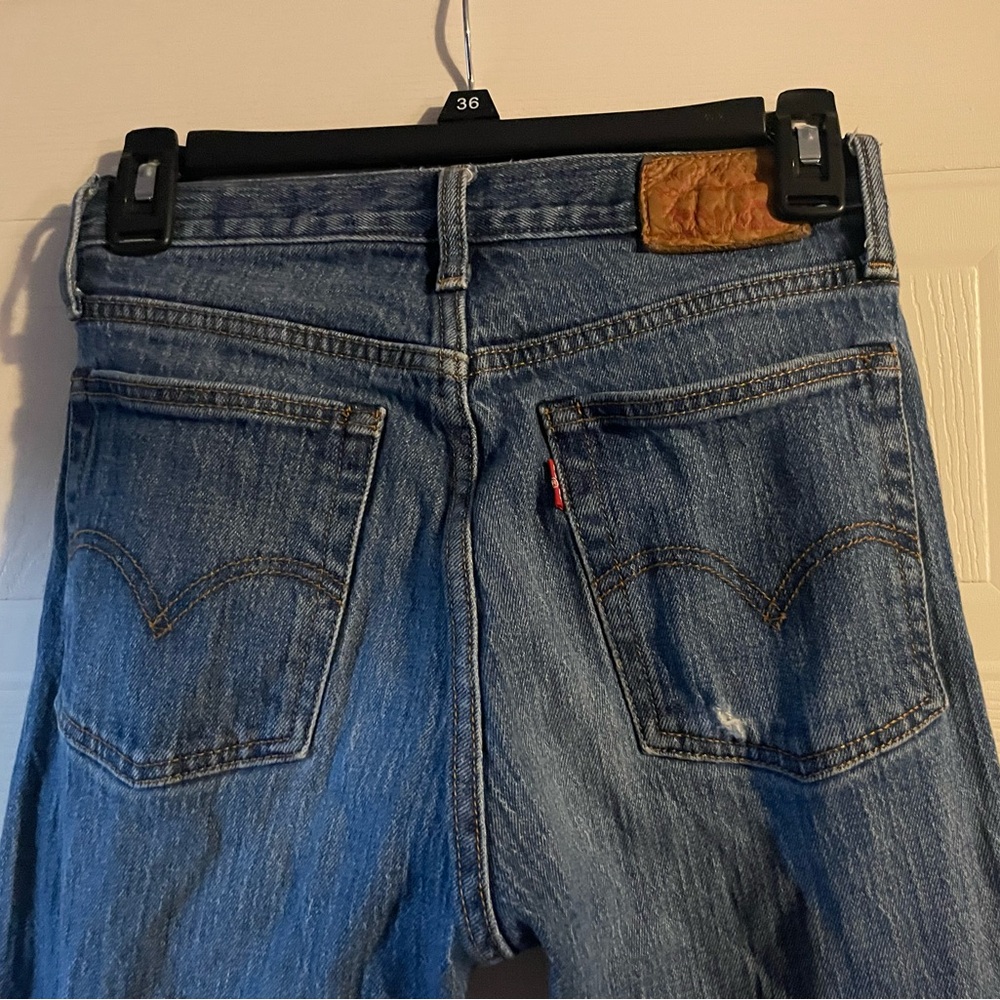 Levi's Classic Blue Straight Leg Jeans with Distressed Details